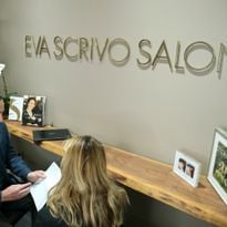 Arik Efros of the Eva Scrivo Salon explaining the benefits of their 401K program to a potential...