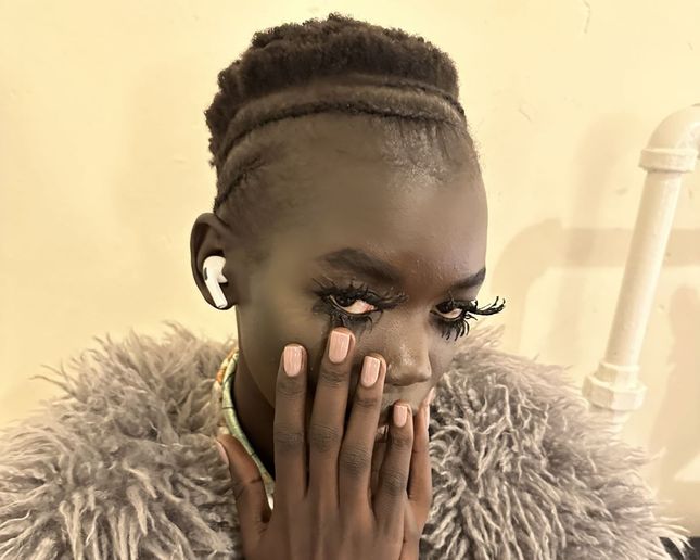 Jin Soon created the unexpected opaque, neutral glossy nails for the Marc Jacobs FW24 Runway.