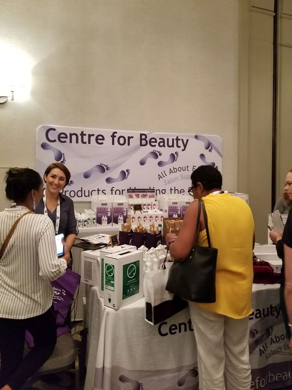 Attendees gathered around the Centre for Beauty table.