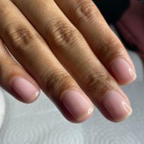 Nail artist Stephanie Staunton created this natural pink shade for Halle Bailey to give off a...