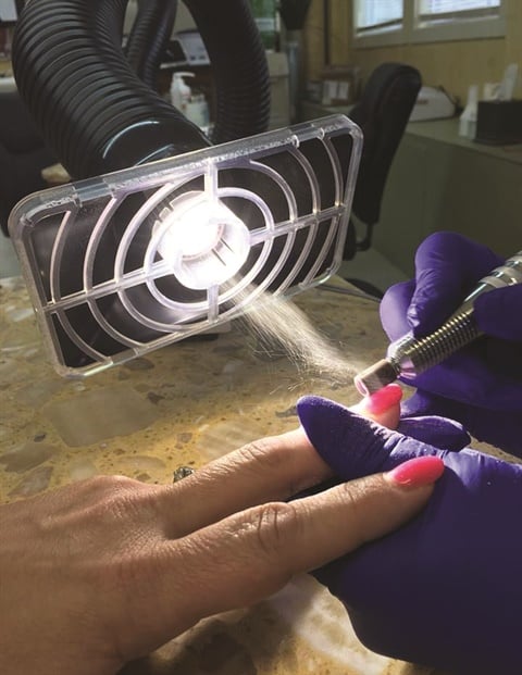 2015 IMC requires that the hood of the source-capture system be no more than 12 inches away from the chemical source; this hood on the Healthy Air unit distributed by Aerovex Systems, is within six inches.