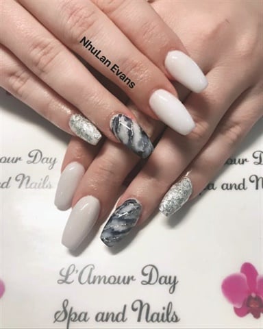 A step-and-repeat creates a consistent, branded background for nail photos. (Nails by NhuLan Evans.)