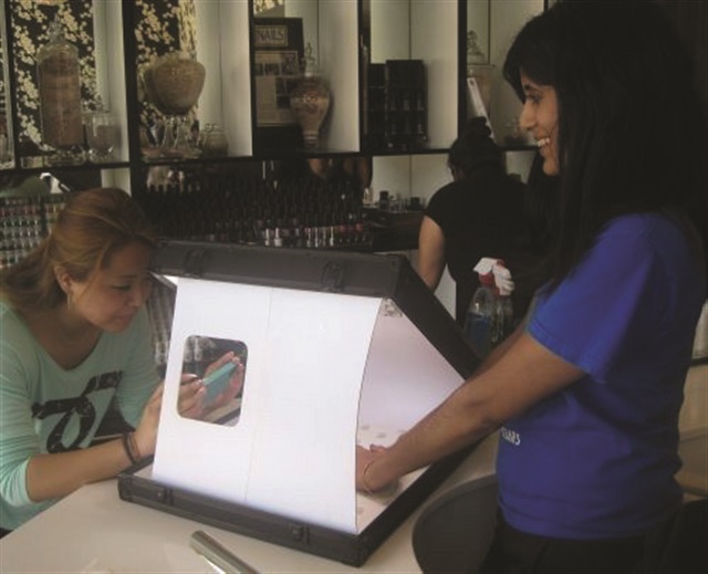Before leaving the salon, clients can snap a pic of their finished nails in a lightbox.