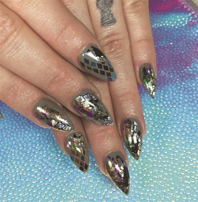 The staff at the Polish Room in Orlando, Fla., keeps backgrounds handy for post-mani photos.