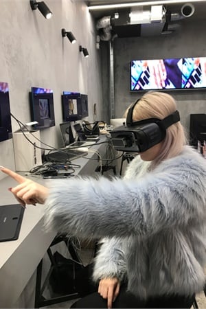 A customer tests out the Virtual Reality Nail Designer at WAH Soho Nail Salon in London.