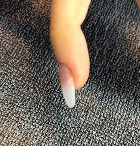 Melissa Finch of Estilo Salon and Spa, Altoona, Iowa, used a tip to correct her client’s ski...