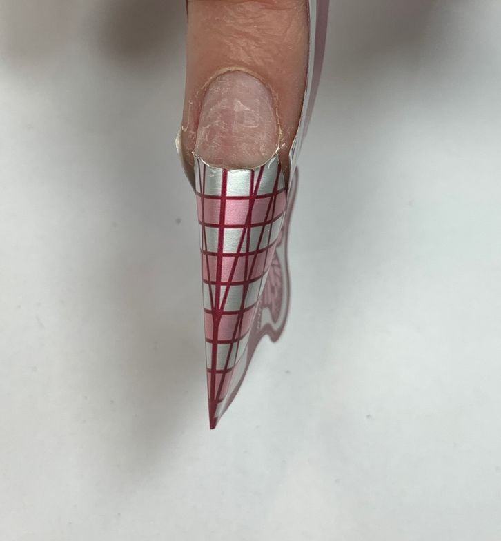 Step 9: Correct adjustments have been made to the nail form. Place the form in the same position...