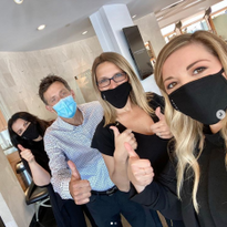 The Mario Tricoci Team gives it the thumbs-up.