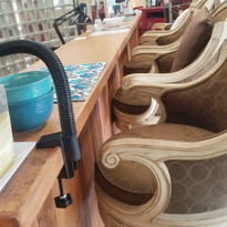 The nail bar was built with recycled wood from pallets. The top is cork flooring, which is...